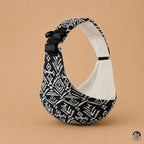Porte bébé sling motif aztek noir de la marque brushhoo vue de côté