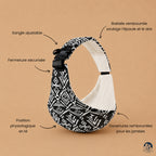 Porte bébé sling motif aztek noir de la marque brushhoo vue de côté avec tous les bénéfices pour maman et bébé