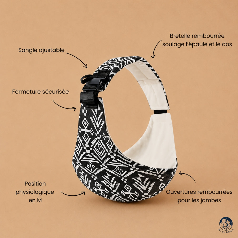 Porte bébé sling motif aztek noir de la marque brushhoo vue de côté avec tous les bénéfices pour maman et bébé