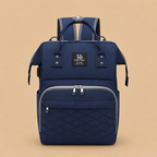 Sac à dos à langer bleu sur un fond beige nuancier en vue de face